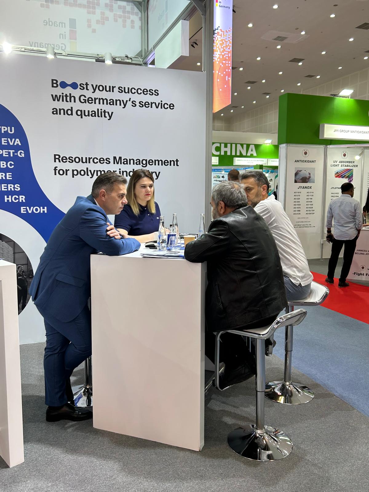Business meeting at the NSB Polymers booth, ArabPlast 2025
